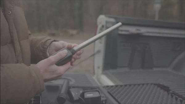 Close-up of someone putting together filming equipment, captured in LOG mode.